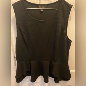 Black peplum sleeveless top.